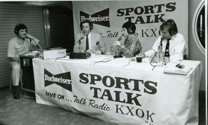Photo: Radio talk-show hosts Jon Sloane (second from left) and Mark Eissman (second from right), during a KXOK broadcast in the late 1980s. Photographer unknown.